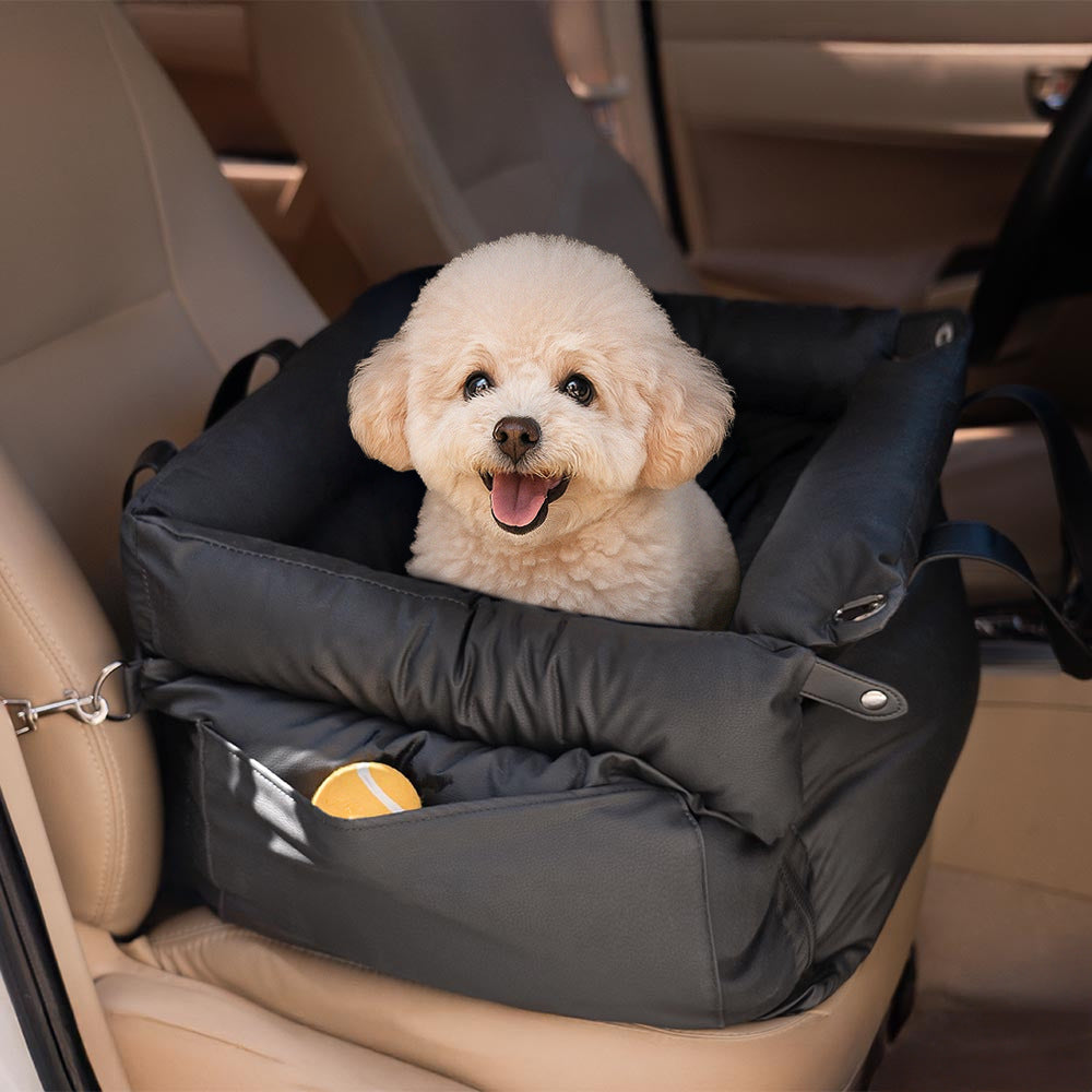 The Windsor Car Nest in Midnight Black, luxury dog travel bed securely placed on a car seat