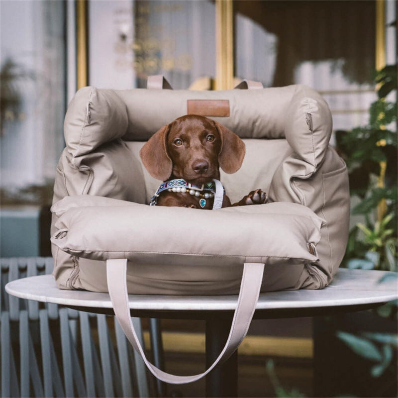 The Windsor Car Nest in Warm Stone, luxury dog travel bed for cars, shown as a stylish and comfortable resting place for dogs